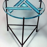 Carved and painted glass end table.