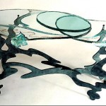 Carved and laminated glass table top.