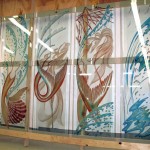 Carved, tempered and painted glass doors.