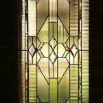 Beveled and leaded glass door.